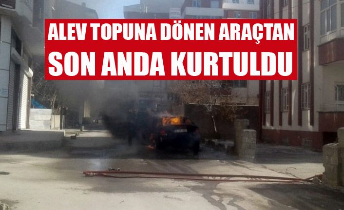 Alev topuna dönen araçtan son anda kurtuldular